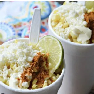 two cups of ice cream with a lime slice