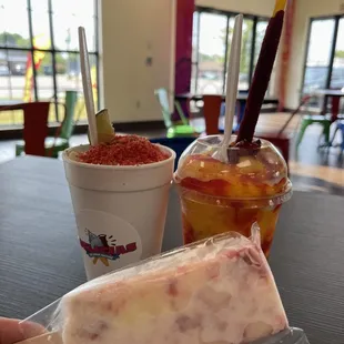 a hand holding a piece of ice cream