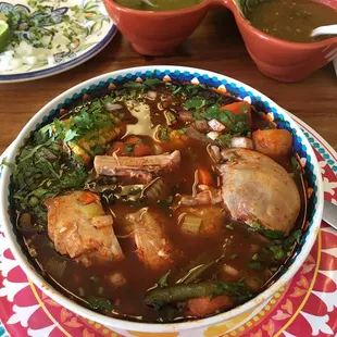 Fantastic spicy chicken soup with leg and thigh, corn, potato, etc. Came with tortillas and lime, onion and cilantro to garnish. Deelicious!