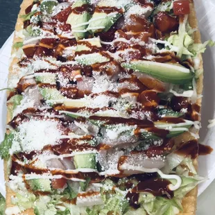 Chicharron Preparado (pork rinds lettuce tomato mayo avocado cheese hot sauce)