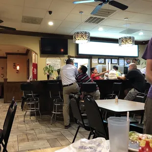 a man standing in a restaurant