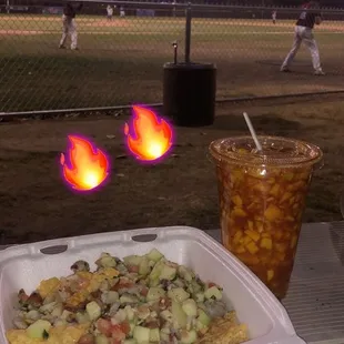 a baseball field with a baseball game in the background
