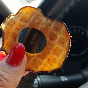 a hand holding a piece of food