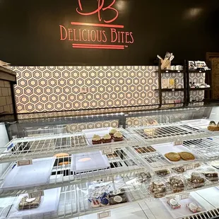 a display case with a variety of desserts