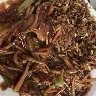 a plate of stir fried rice and vegetables