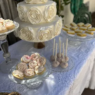 a wedding cake and cupcakes