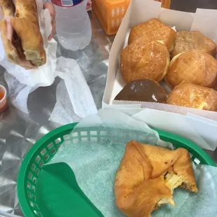 a basket of croissants and a sandwich