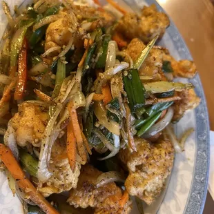 a plate of stir fried vegetables