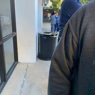 a man walking down a sidewalk