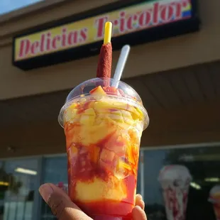Mangonada mango ice cream with Mango pieces Chile and chamoy