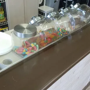 a counter with a variety of sweets