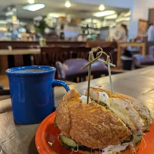 A perfect bagel sandwich and hot chocolate with almond milk