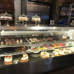 a display of cakes and pastries
