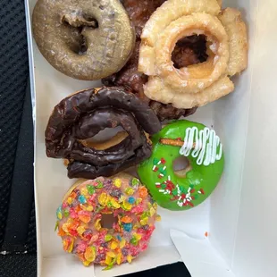 Fruity pebble, Christmas tree, old fashioned, apple fritter and blueberry cake donuts