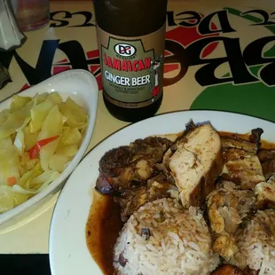 Jerk chicken  (white meat), rice and beans with cabbage.
