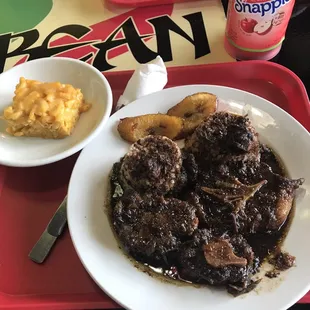 Oxtails with rice n beans with Mac n cheese with plantains