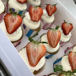 Tres leches cupcakes with homemade whipped cream and fresh berries