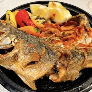 a plate of fish and vegetables