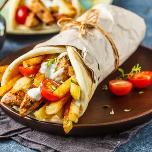 a pita with fries and tomatoes