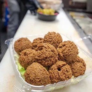 Fresh falafel made with love and fried served with tahini and veggie&apos;s