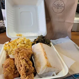 a tray of fried chicken, macaroni and cheese