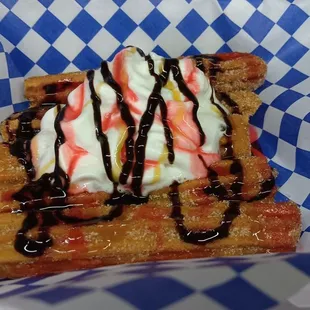Churros with strawberry chocolate and caramel