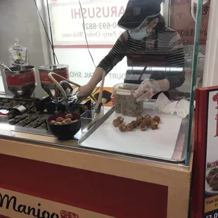 She's making walnut mini cakes!