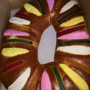 a chocolate donut with colorful icing