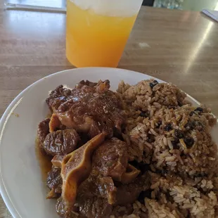 Oxtail, dirty rice, and fresh passion fruit juice