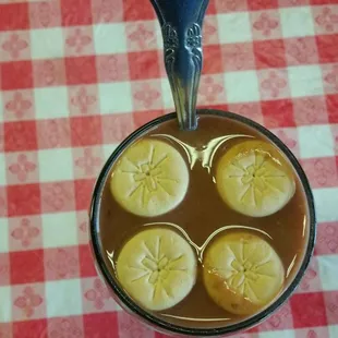 a cup of hot chocolate with lemons