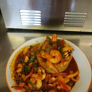 a plate of shrimp and vegetables