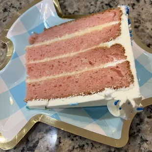 A slice of yum champagne buttercream and strawberry cake