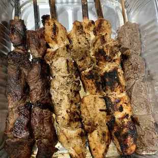 Family meal: 3 steak (2 well done &amp; 1 rare steak) &amp; 3 chicken kebabs, tray of rice, Pico de Gallo &amp; famous homemade cilantro sauce