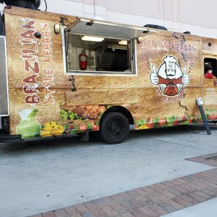 a food truck parked on a sidewalk