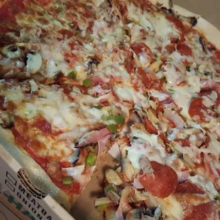 a whole pizza in a box