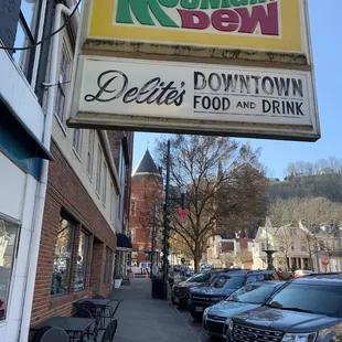 a restaurant sign on the side of a building