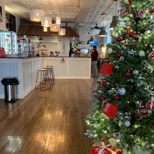 a decorated christmas tree in a restaurant