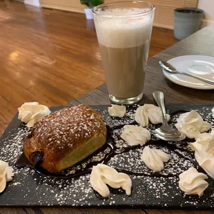 a pastry and a glass of coffee