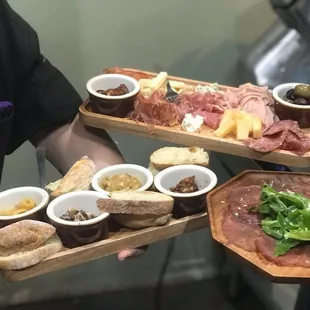 two people holding plates of food