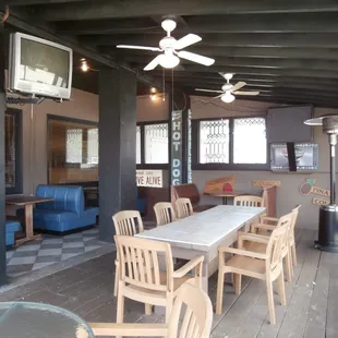 a dining area with a table and chairs