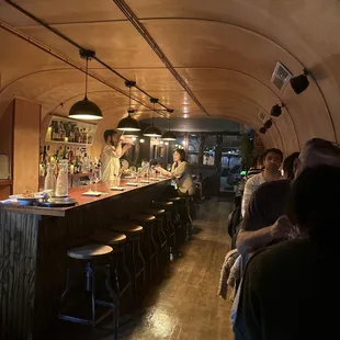 a group of people sitting at a bar