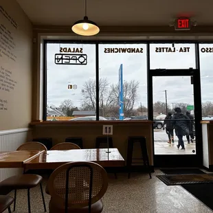 a person entering a coffee shop