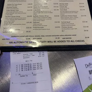 Menu stating 18% gratuity and check offering and additional amount if you so chose.