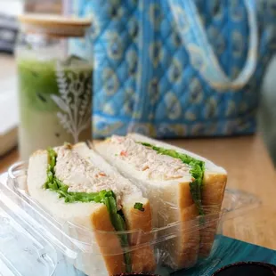 The tuna potato salad sandwich from Dell's is less than $5.  Delicious!