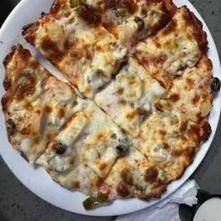 Pineapple, jalapeños, olives, personal pizza
