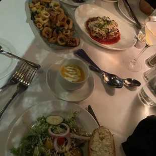 Tuscan Delmonicos Salad, Fried Calamari, Lobster Bisque, eggplant Parmesan