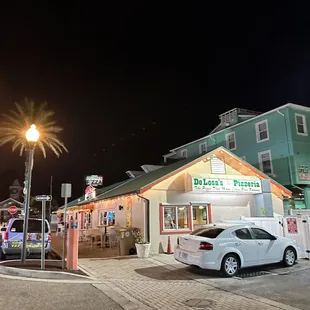 a car parked in front of a restaurant