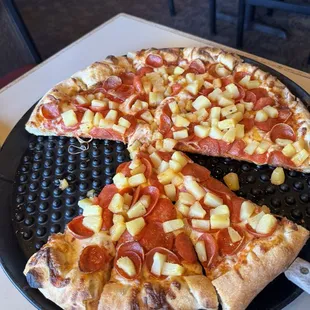 Pepperoni and pineapple pizza