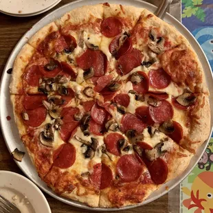 14&quot; pepperoni and mushroom pizza.