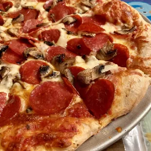 14&quot; pepperoni and mushroom pizza.